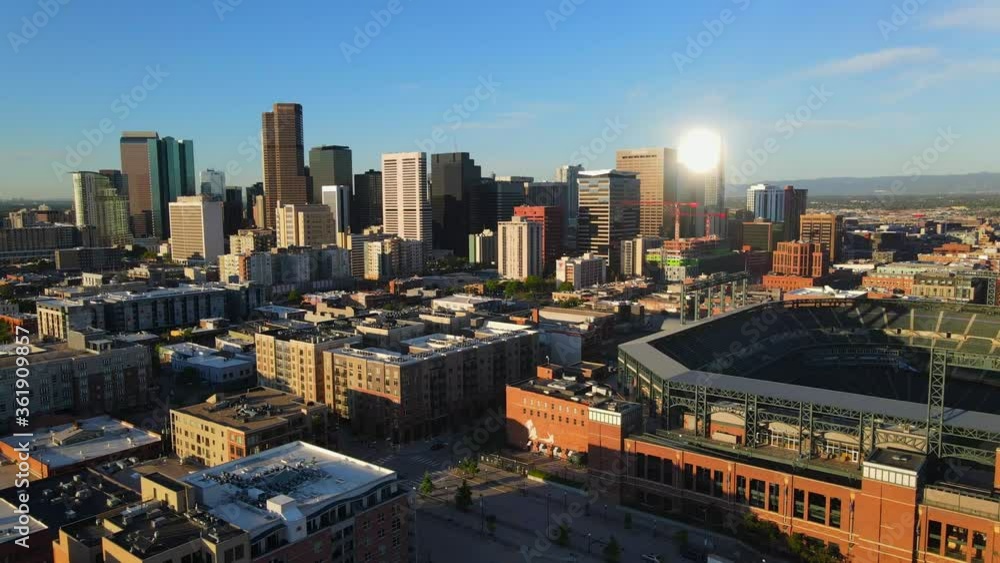 downtown cityscape of buildings in Denver Colorado with Coors field and
