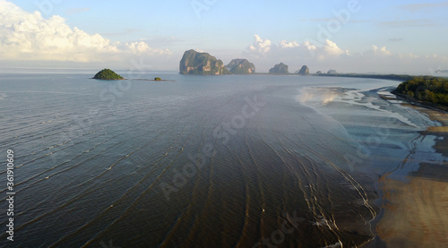 An unspoilt beach of Pak meng, Sikao District, Trang Province, Thailand. A natural beauty of crystal clear sea water, white sandy beach and distant islands located at Southern Thailand photo