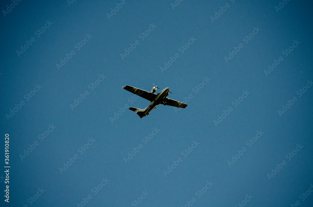 Airplane flying in the blue sky Airplane flying in the blue sky