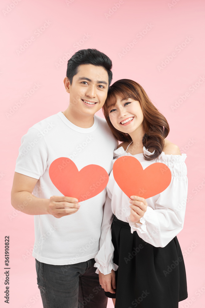 Couple Holding an Heart, symbol of Love, on Valentine's Day Couple Holding an Heart, symbol of Love, on Valentine's Day