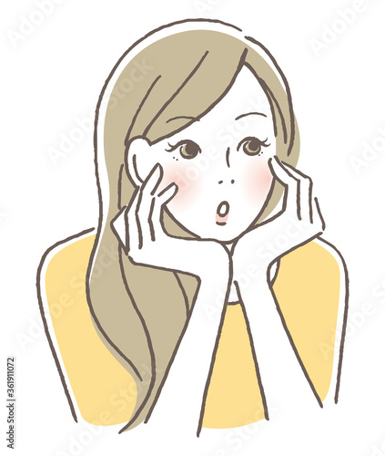 頬杖をついて考える女性