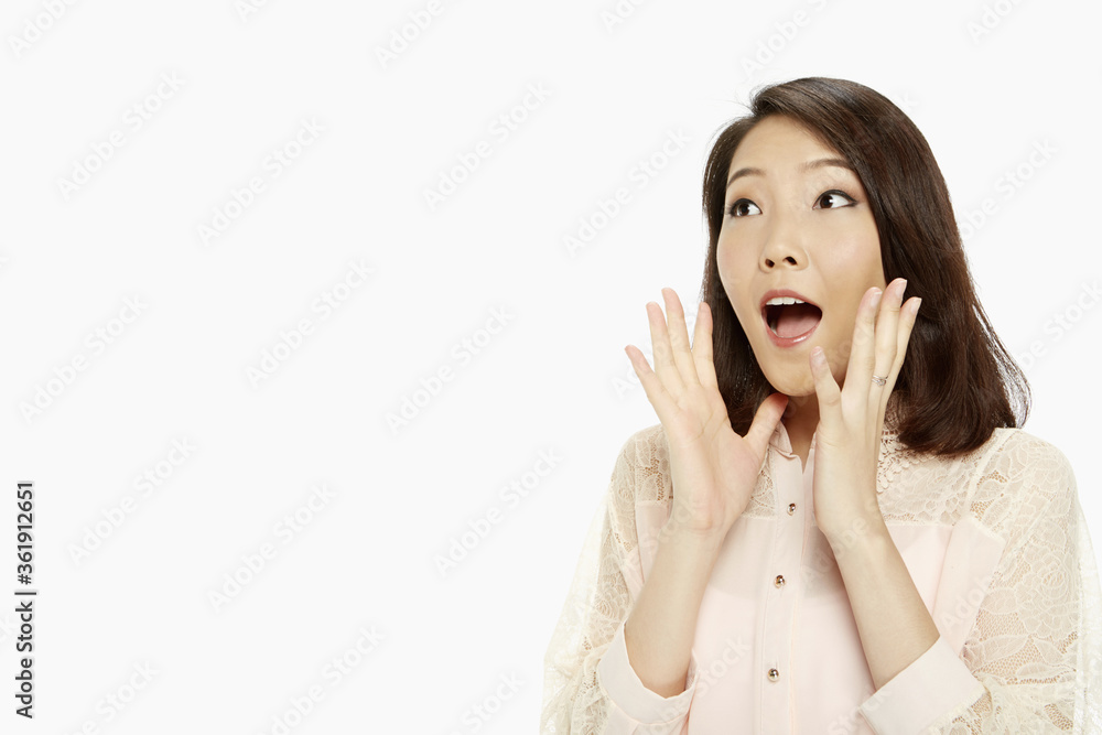 Woman with a shocked facial expression Woman with a shocked facial expression