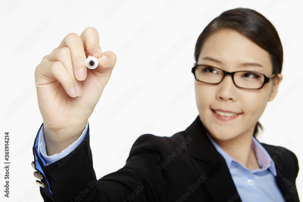 Businesswoman showing writing gesture Businesswoman showing writing gesture