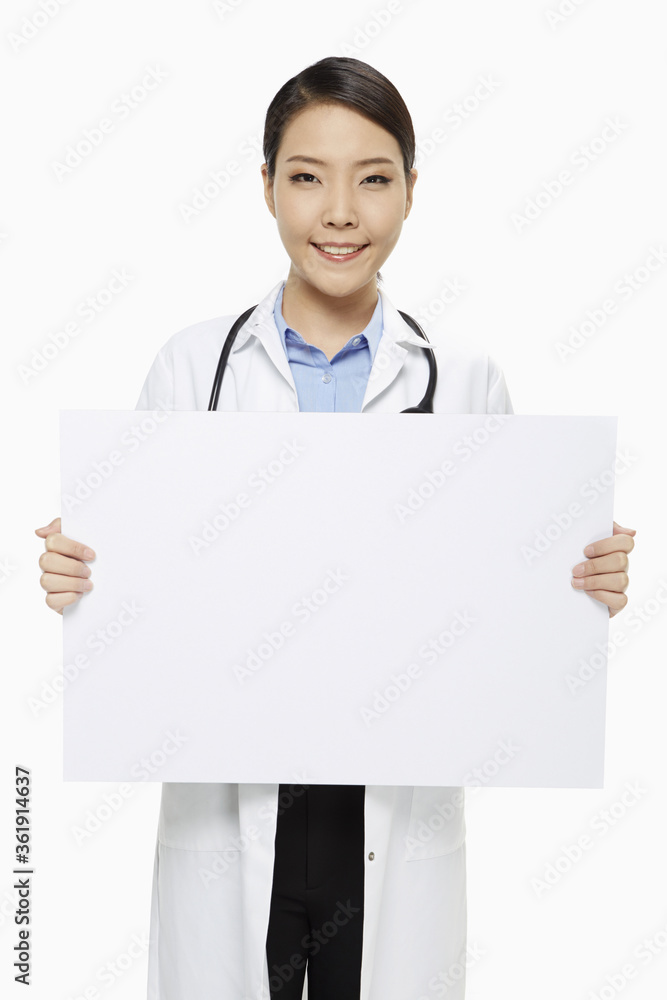 Medical personnel holding up a blank placard Medical personnel holding up a blank placard