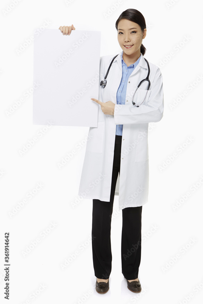 Medical personnel holding up a blank placard Medical personnel holding up a blank placard