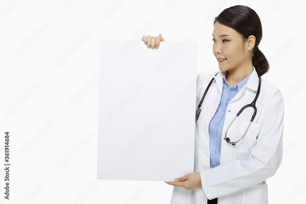 Medical personnel holding up a blank placard Medical personnel holding up a blank placard