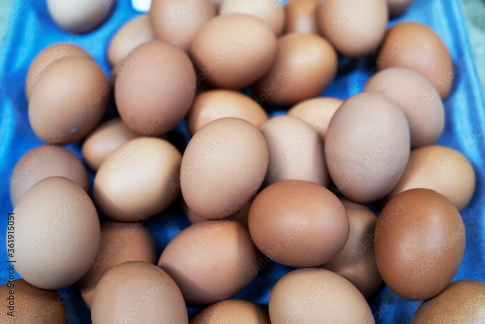 Abstract soft blurred of fresh chicken eggs for sale in the market.