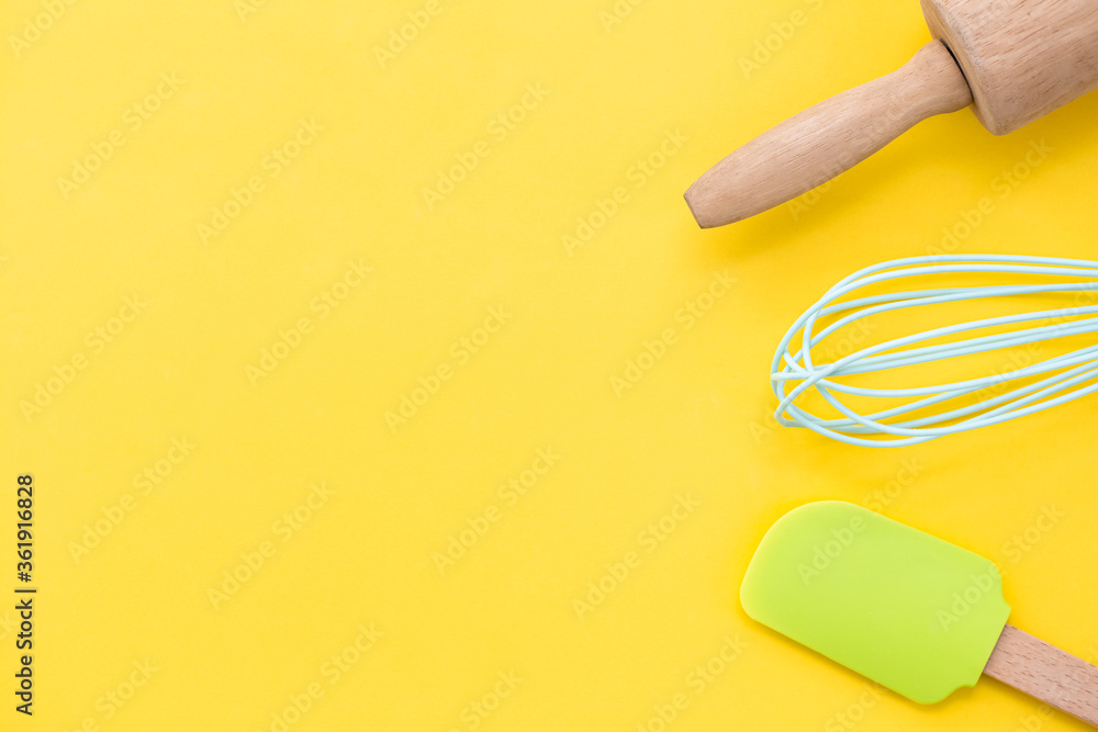 top view baking utensils on yellow background with copy space top view baking utensils on yellow background with copy space