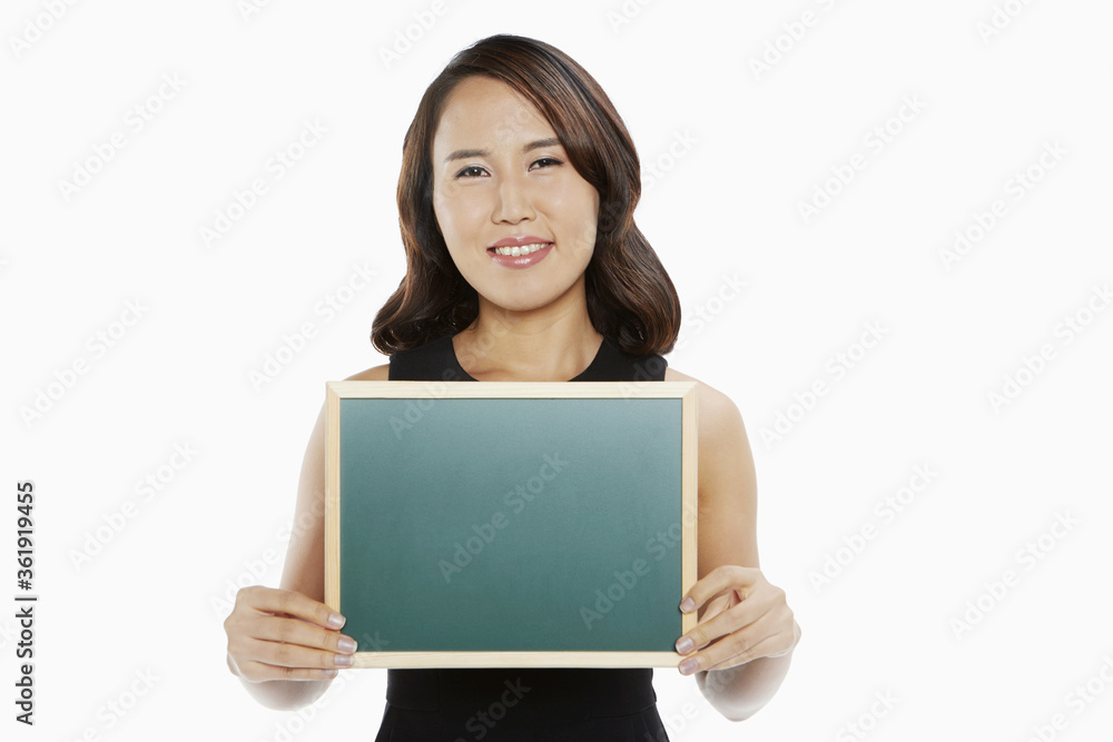Woman holding up a blackboard Woman holding up a blackboard