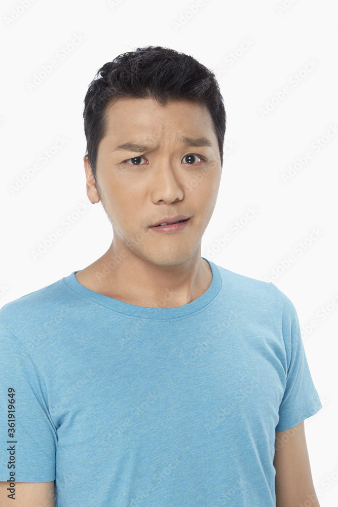 Man with an uncertain look on his face Man with an uncertain look on his face