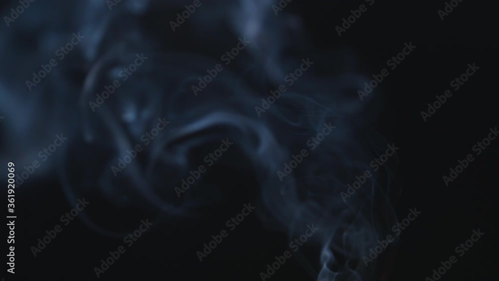 Atmospheric smoke 4K Fog effect. Smoke in slow motion on black background. White smoke slowly floating through space against black background Atmospheric smoke 4K Fog effect. Smoke in slow motion on black background. White smoke slowly floating through space against black background