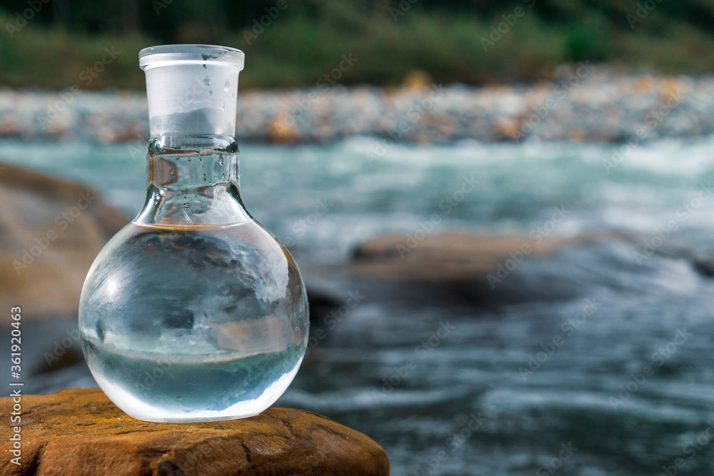 Glass flask with clean drinking water. Glass flask with clean drinking water.