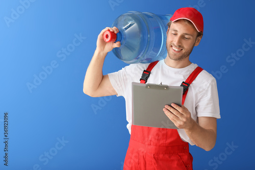 Delivery man with bottle of...