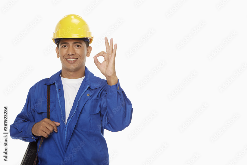 Construction worker showing hand gesture