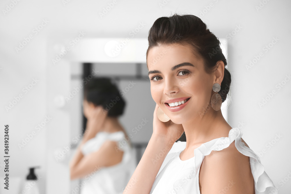 Young woman with stylish hairdo in beauty salon Young woman with stylish hairdo in beauty salon