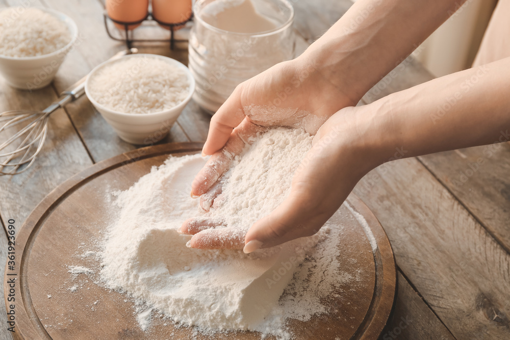 Woman with rice flour at table Woman with rice flour at table