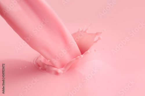 Pouring of fresh pink milk, closeup