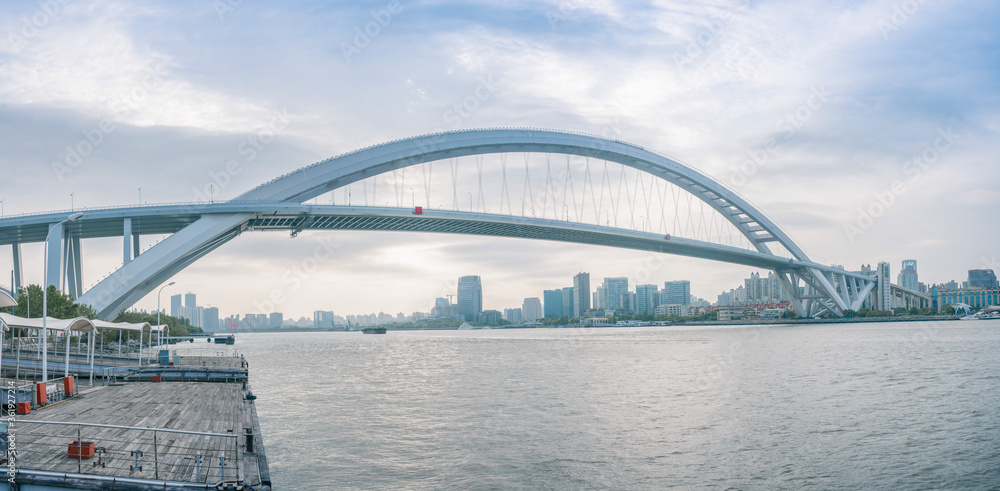 Fototapeta premium Panorama view of Lupu Bridge, on of the biggest bridge on Huangpu river, shot in Shanghai, China.