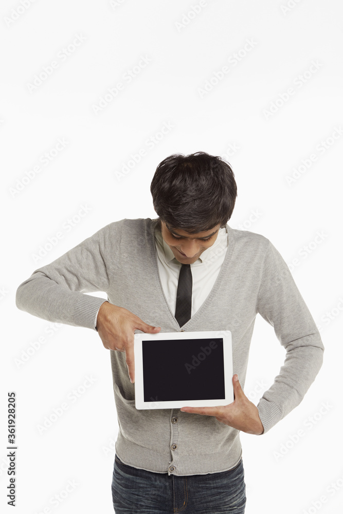 Man holding up a digital tablet Man holding up a digital tablet
