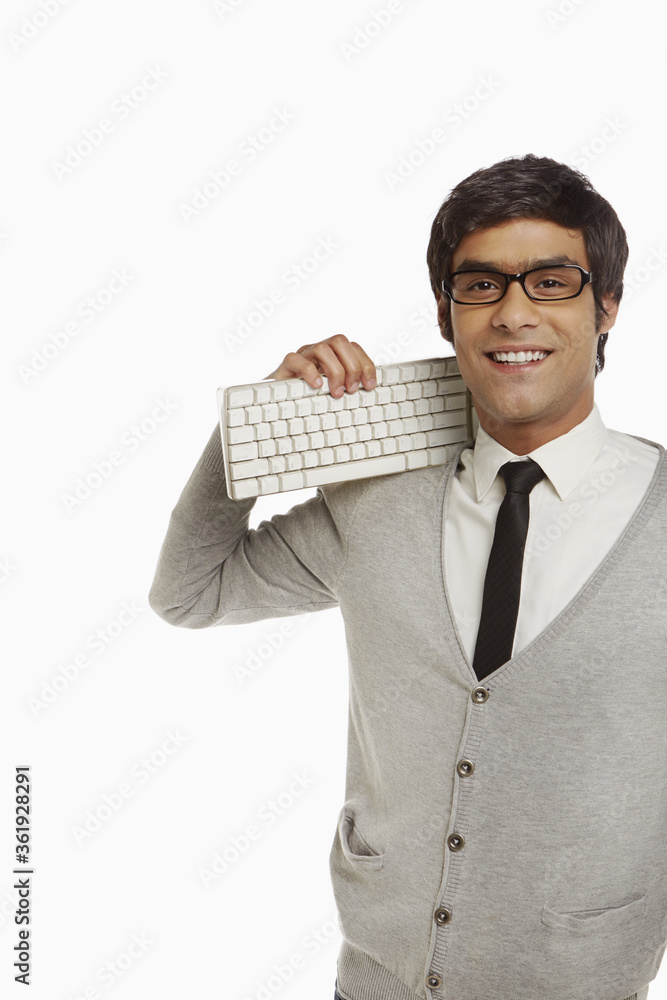 Man holding a computer keyboard