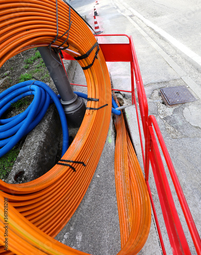 orange pipe for laying the optical fibers to connect companies a photo