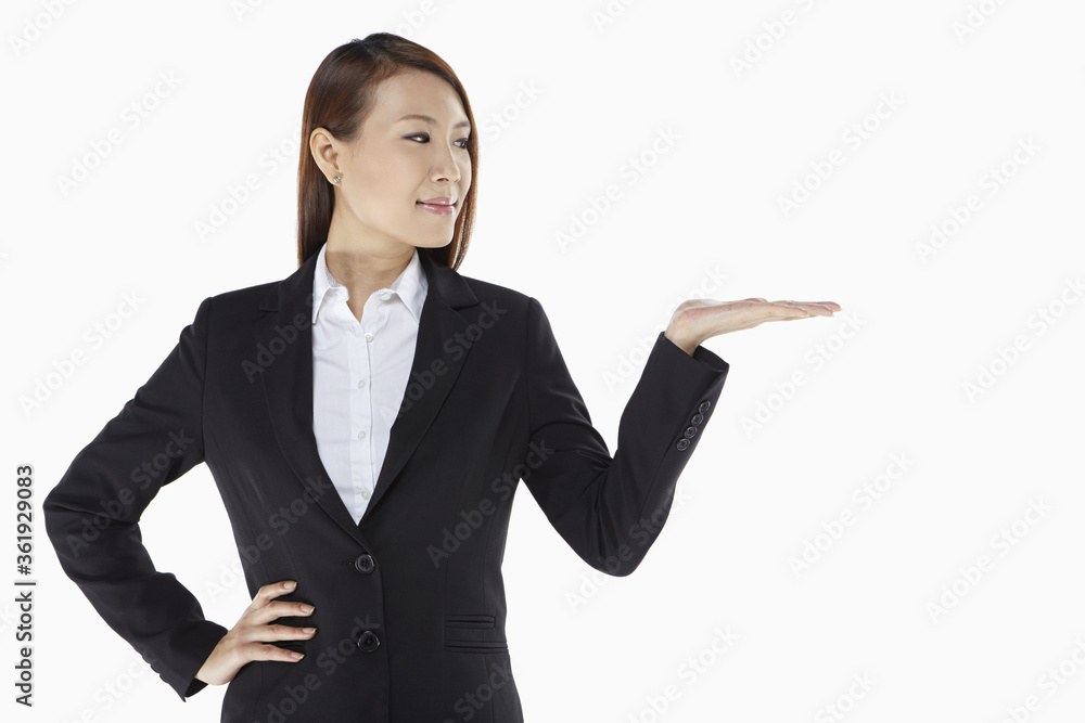 Businesswoman smiling and showing hand gesture Businesswoman smiling and showing hand gesture