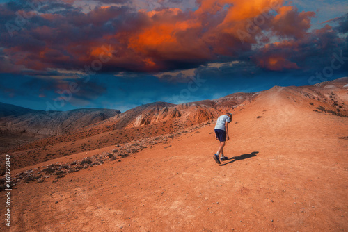 Teen boy in valley of Mars ...