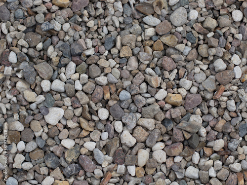 pebbles background. Many small and gray stones  seamless texture. seamless pattern of stones or gravel