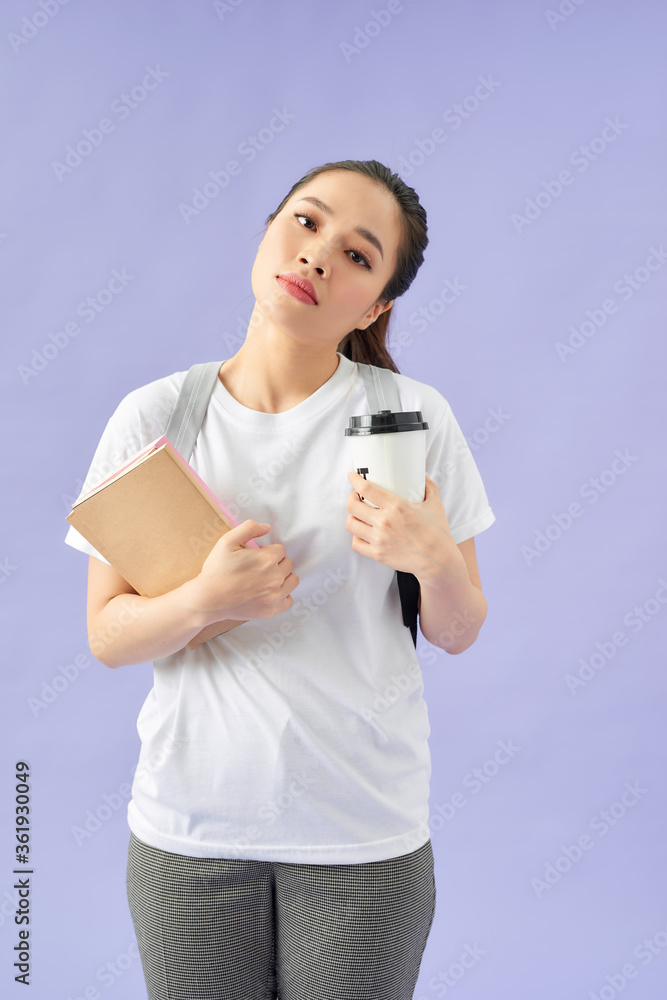 Young student woman wearing backpack holding book over purple background stressed with hand on head, Young student woman wearing backpack holding book over purple background stressed with hand on head,