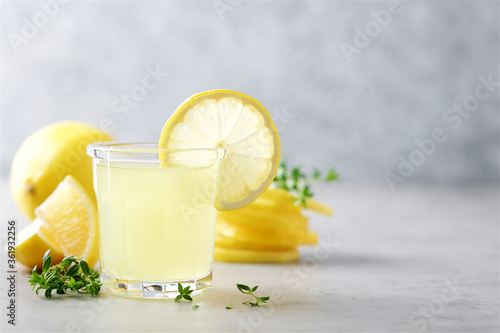Billede på lærred Glass of limoncello traditional Italian alcoholic drink decorated with thyme