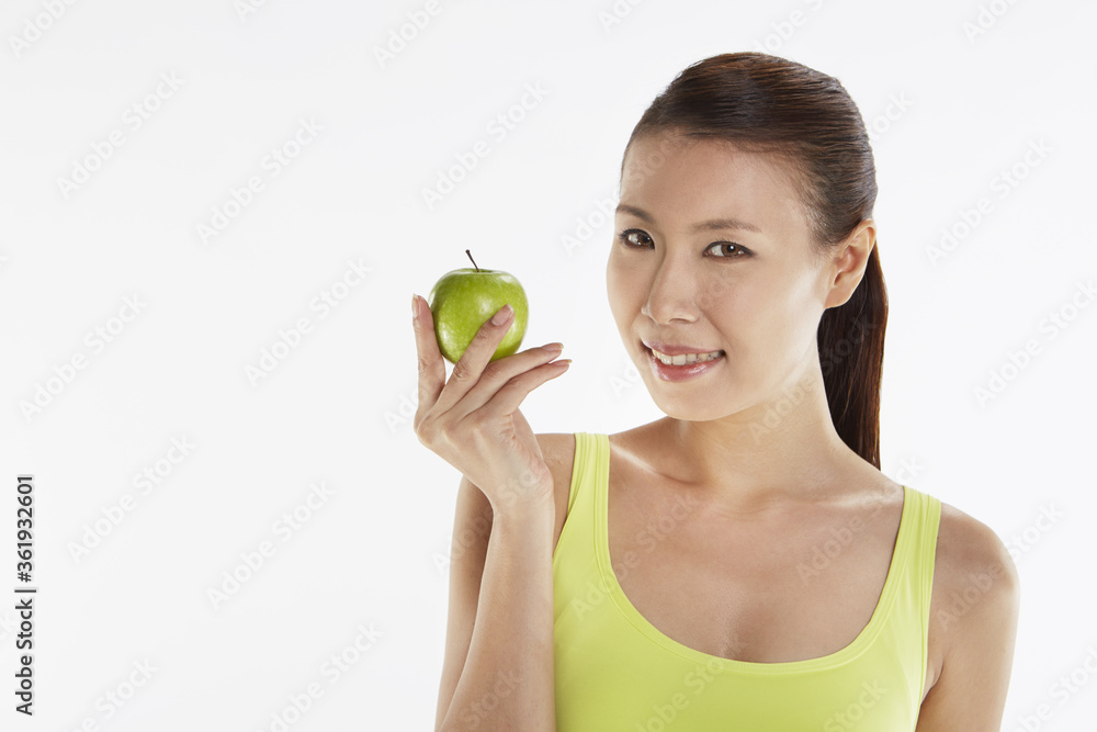 Woman holding a green apple Woman holding a green apple