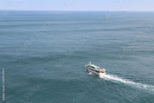 View of a ferry on the sea at Taejongdae recreational park, Busan, South Korea © Crystaltmc