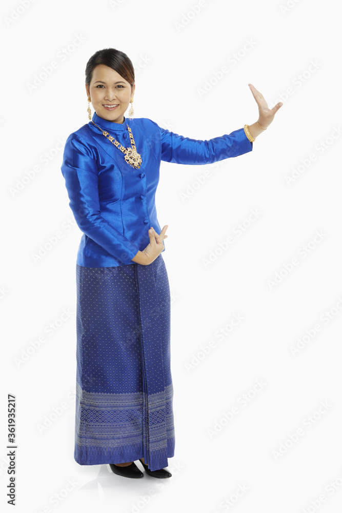 Women in traditional clothing showing dance poses Women in traditional clothing showing dance poses