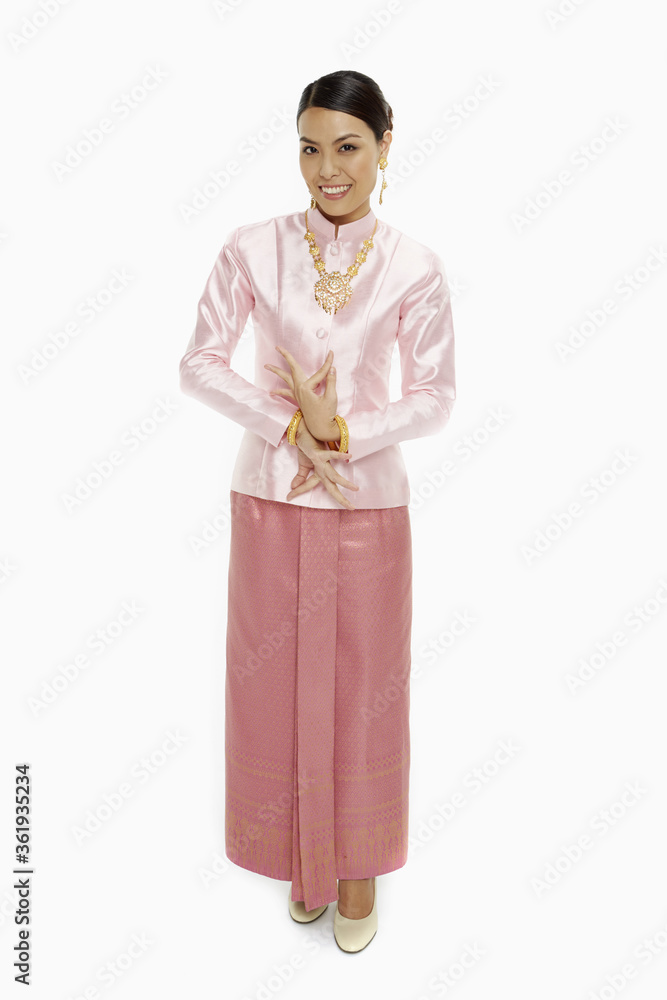 Women in traditional clothing showing dance poses Women in traditional clothing showing dance poses