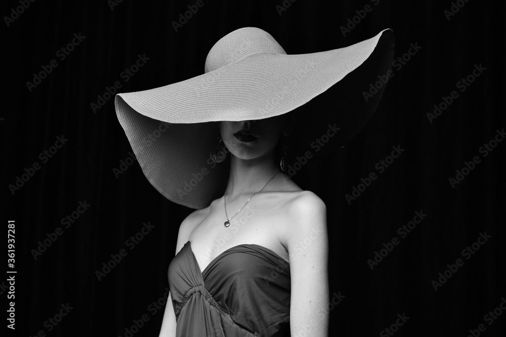 young and beautiful girl in a red dress and a hat young and beautiful girl in a red dress and a hat