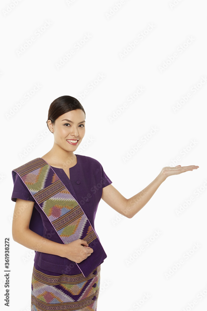Woman in traditional clothing showing hand gesture Woman in traditional clothing showing hand gesture