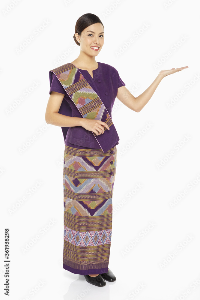 Woman in traditional clothing showing hand gesture Woman in traditional clothing showing hand gesture