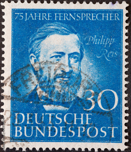 GERMANY - CIRCA 1952: a postage stamp printed in Germany showing a a portrait of Philipp Reis on the occasion of 75 years of telephony, circa 1952