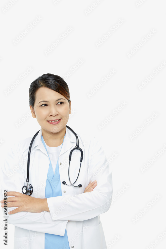 Medical personnel standing with arms crossed, smiling Medical personnel standing with arms crossed, smiling