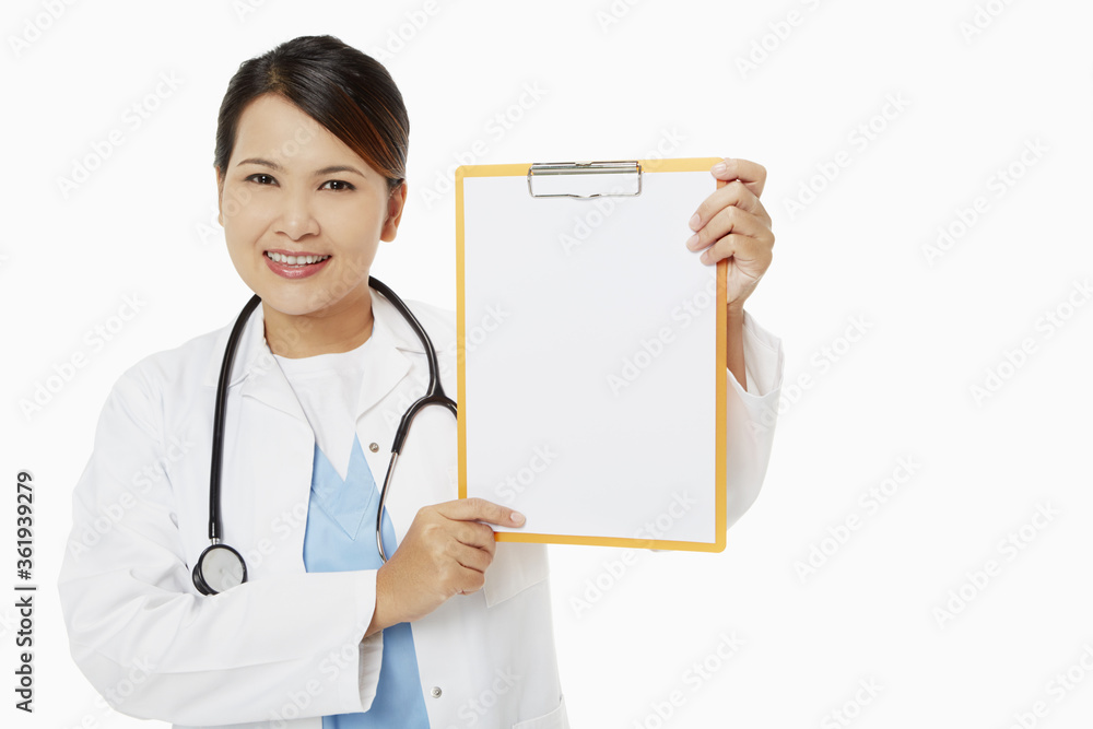 Medical personnel smiling and holding up a blank clipboard Medical personnel smiling and holding up a blank clipboard