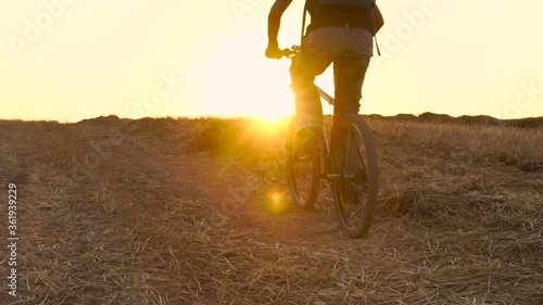 Man Riding Bicycle During Sunset, Outdoors Activity, Sport ,Summer Field - slow motion