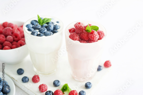 Yogurt cocktail and parfait. Natural detox. Liquid ice cream. Healthy food and breakfast. Good morning. Berry Milk Smoothie with blueberries  strawberries  raspberries. Fresh diet dessert. Summer card