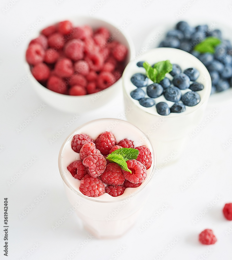 Yogurt cocktail and parfait. Natural detox. Liquid ice cream. Healthy food and breakfast. Good morning. Berry Milk Smoothie with blueberries, strawberries, raspberries. Fresh diet dessert. Summer card Yogurt cocktail and parfait. Natural detox. Liquid ice cream. Healthy food and breakfast. Good morning. Berry Milk Smoothie with blueberries, strawberries, raspberries. Fresh diet dessert. Summer card