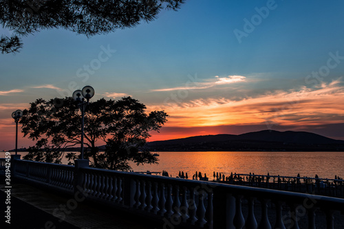 sunset over the mountains and sea  view from the embankment of the resort city of Gelendzhik