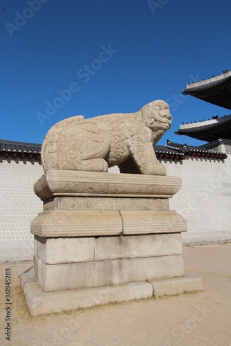 Mythological lion Haechi statue at Gyeongbokgung Palace gate in Seoul, South Korea