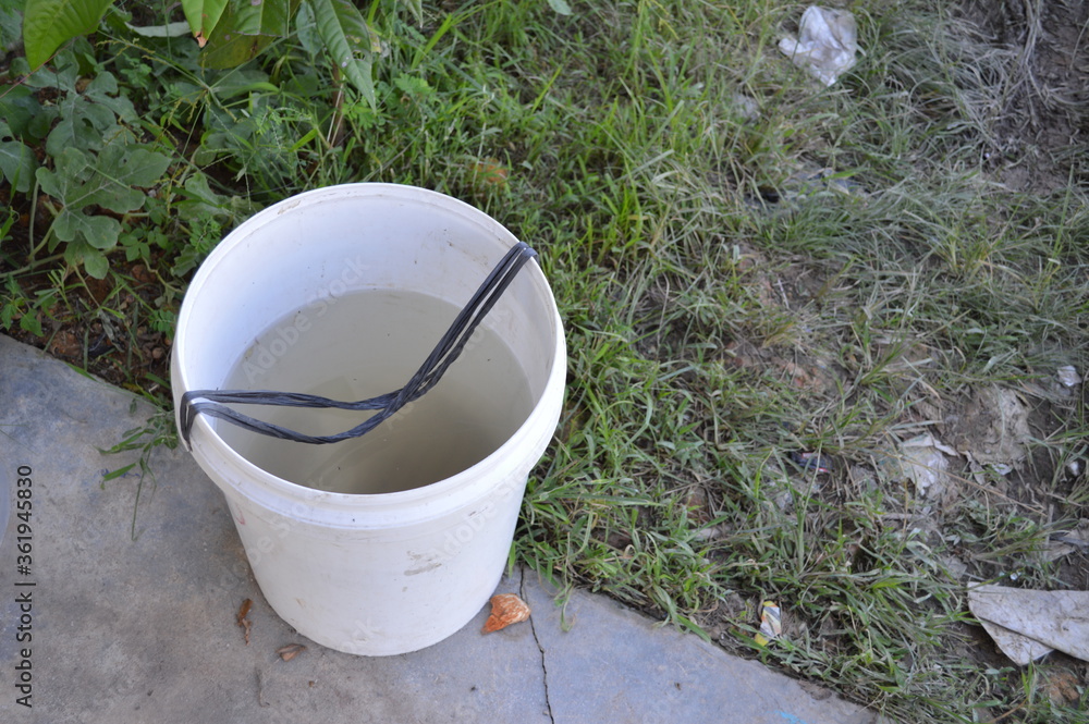 photo of a white bucket filled with water