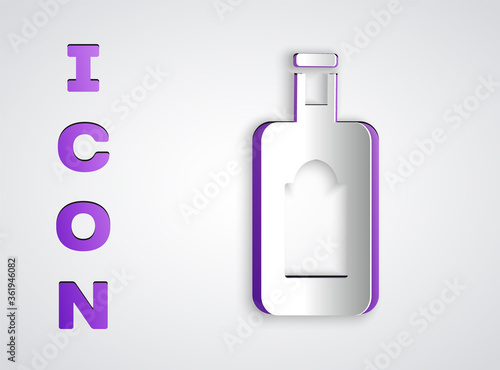 Paper cut Whiskey bottle icon isolated on grey background. Paper art style. Vector Illustration.