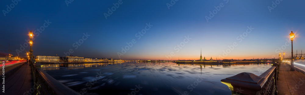 Sunset in St. Petersburg, Russia. Ice drift on the Neva River in the center of St. Petersburg on the sunset