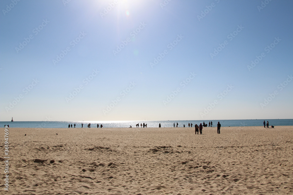 View of Haeundae beach in sunny day with the tourists walking around, Busan, South Korea