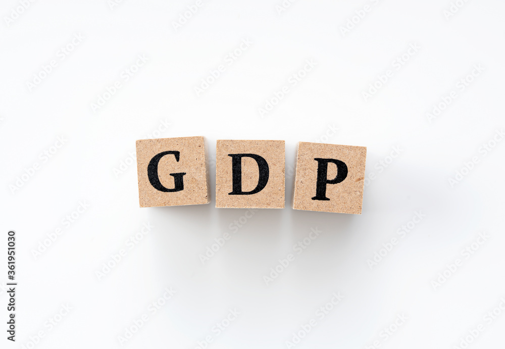 A wooden block with the word GDP written on it on a white background A wooden block with the word GDP written on it on a white background